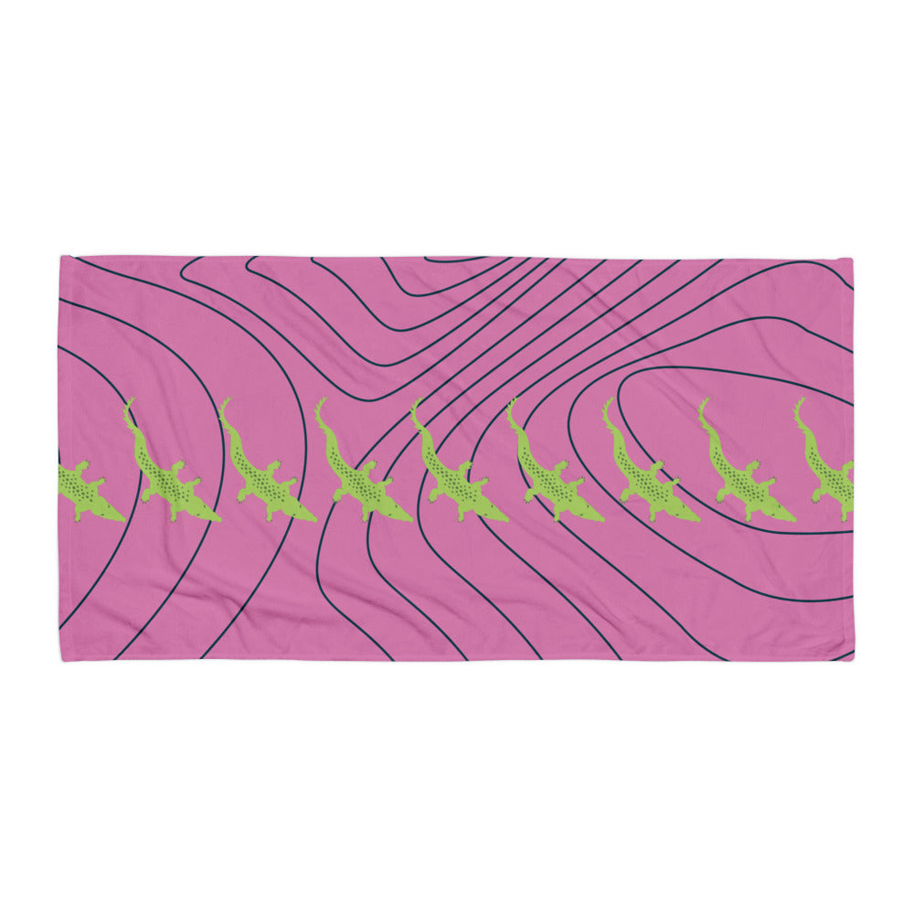 Pink towel with green crocodiles